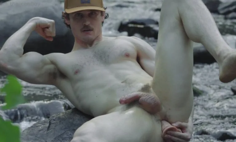 Tom The Cowboy uses a dildo by the river and then cums